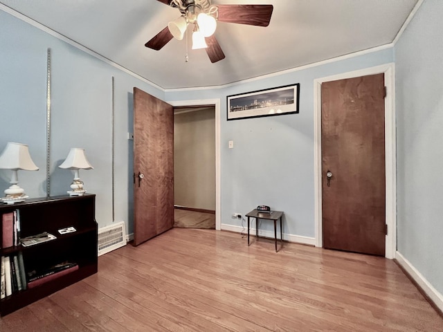 9214 S Sacramento Ave, Evergreen Park, IL 60805 - bedroom with wood finished floors, ornamental molding, a ceiling fan, and baseboards