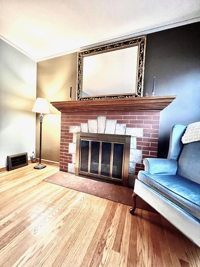 9214 S Sacramento Ave, Evergreen Park, IL 60805 - living area featuring a fireplace with flush hearth, wood finished floors, and ornamental molding