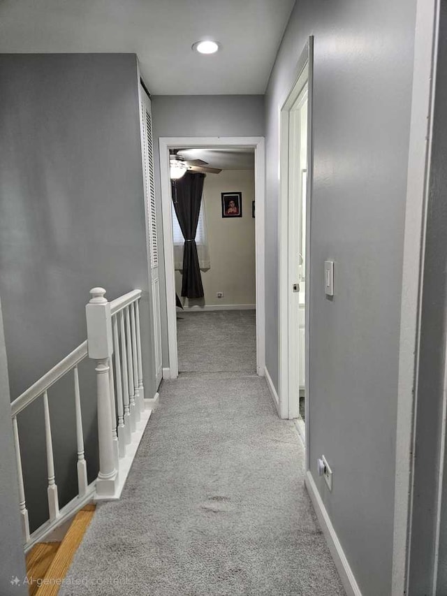 441 Commanche Trl, Wheeling, IL 60090 - hallway featuring an upstairs landing, baseboards, and carpet flooring