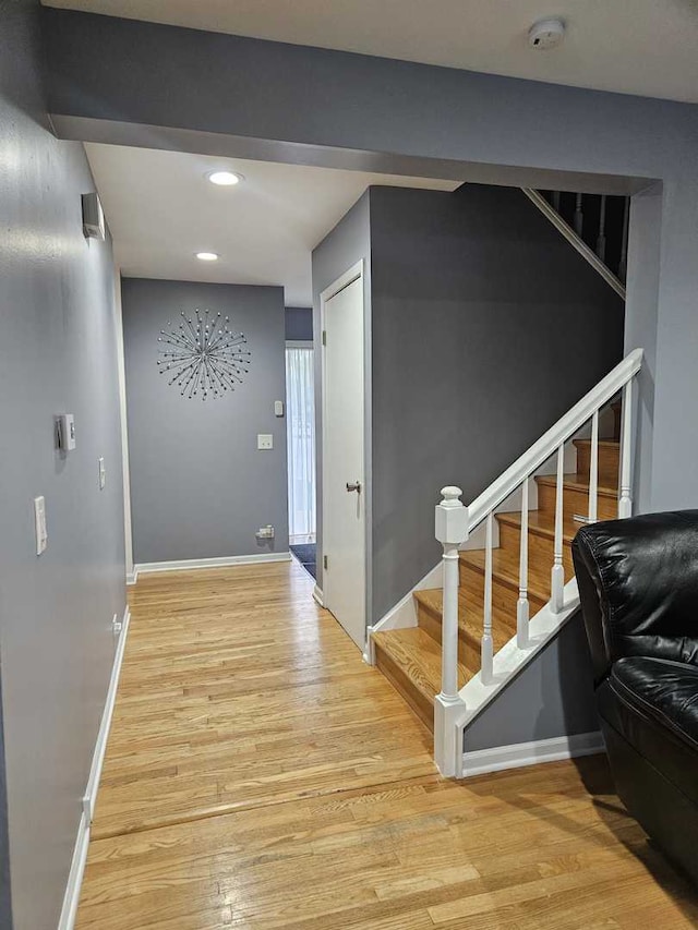 441 Commanche Trl, Wheeling, IL 60090 - corridor featuring light wood finished floors, baseboards, recessed lighting, and stairway