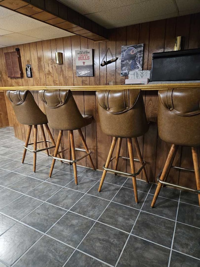 441 Commanche Trl, Wheeling, IL 60090 - indoor dry bar with wooden walls and dark tile patterned floors
