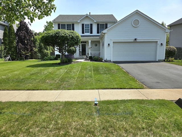 3331 Banford Cir, Lake In The Hills, IL 60156 - view of front facade with a front lawn, asphalt driveway, a garage, and a porch
