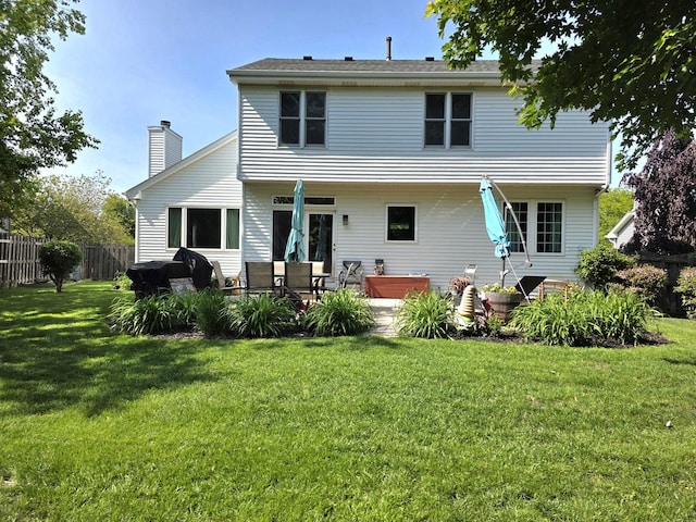 3331 Banford Cir, Lake In The Hills, IL 60156 - rear view of house with a chimney and a patio
