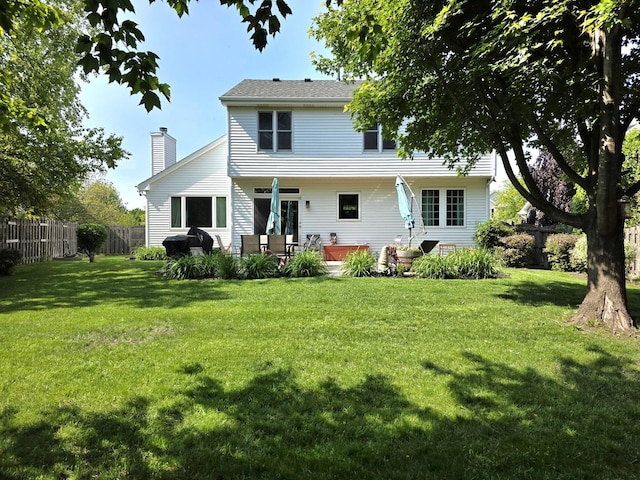 3331 Banford Cir, Lake In The Hills, IL 60156 - rear view of house with a chimney and a patio area