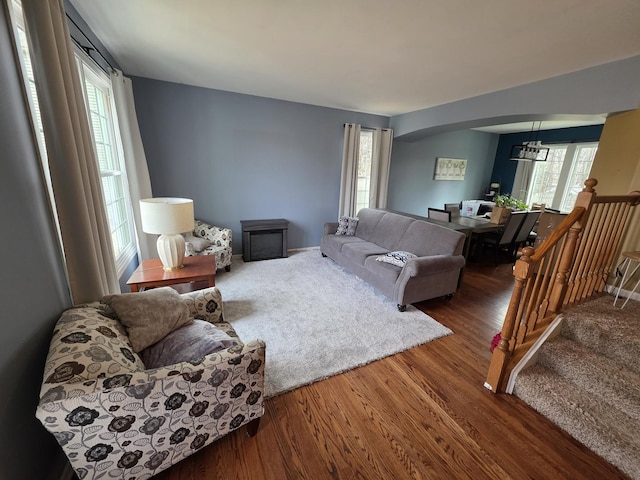3331 Banford Cir, Lake In The Hills, IL 60156 - living room featuring arched walkways, wood finished floors, and healthy amount of natural light