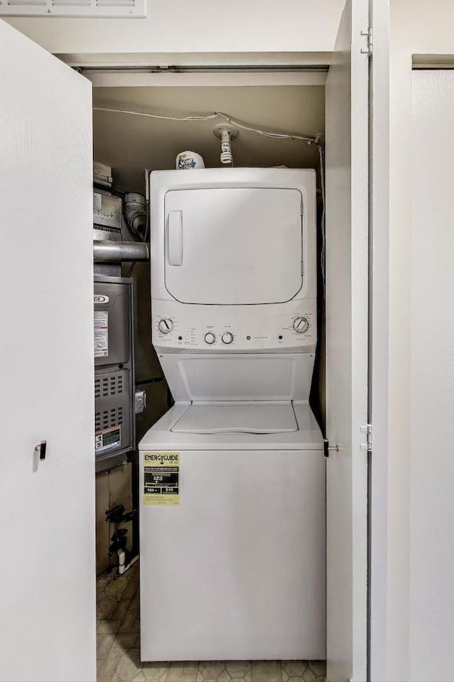 215 W Jennifer Ln Unit 1, Palatine, IL 60067 - laundry room with stacked washer / dryer