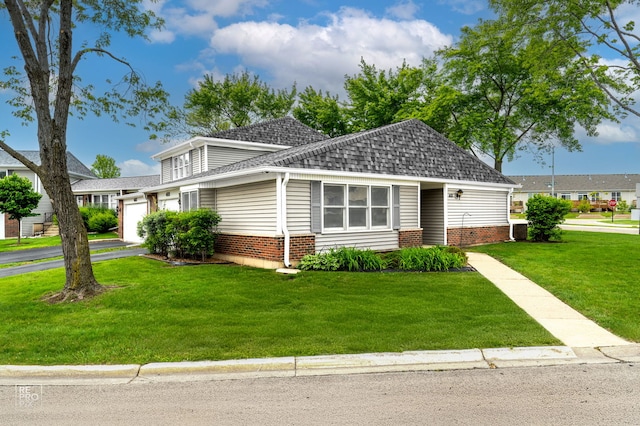 401 Monet Cir, Bolingbrook, IL 60440 - view of front of house featuring a garage, a front lawn, brick siding, asphalt driveway, and a shingled roof