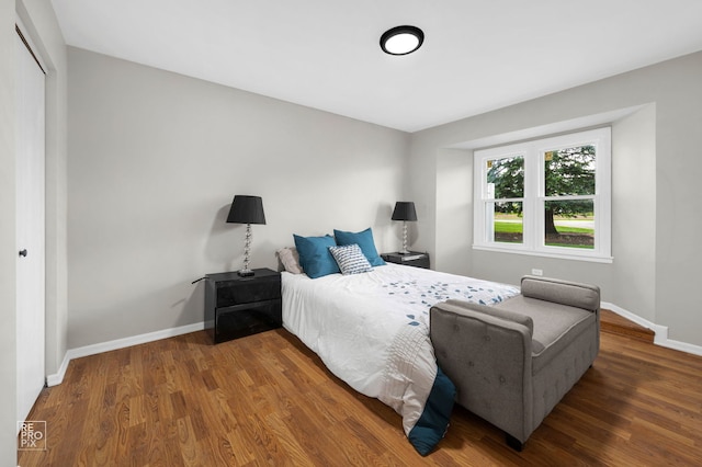 401 Monet Cir, Bolingbrook, IL 60440 - bedroom featuring wood finished floors, a closet, and baseboards