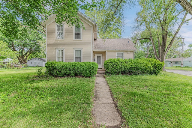 552 Walnut Ave, Elgin, IL 60123 - traditional-style home featuring a front lawn