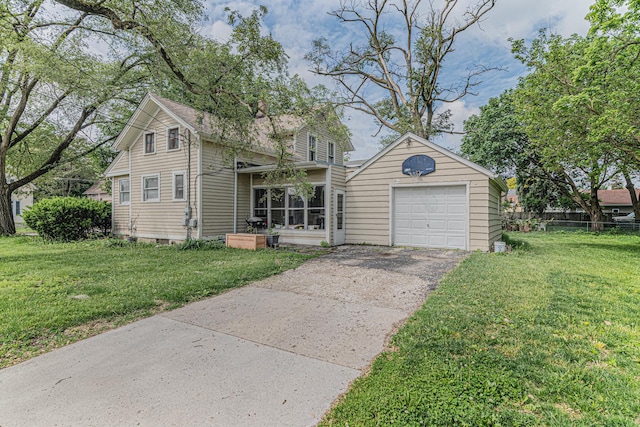 552 Walnut Ave, Elgin, IL 60123 - traditional-style house featuring a front yard and asphalt driveway