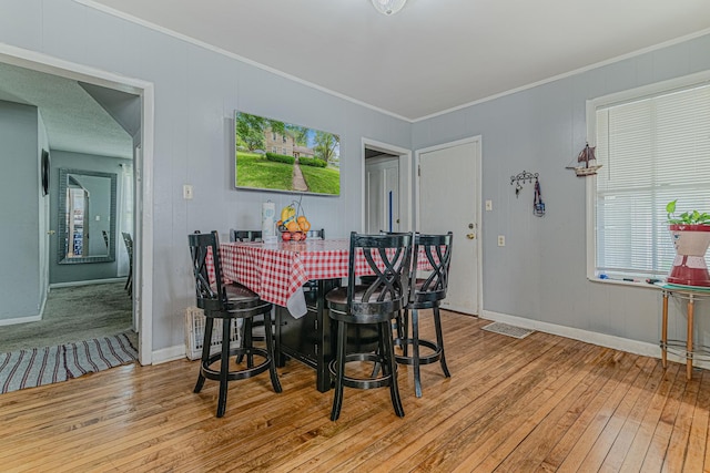 552 Walnut Ave, Elgin, IL 60123 - dining space featuring hardwood / wood-style floors, baseboards, and ornamental molding