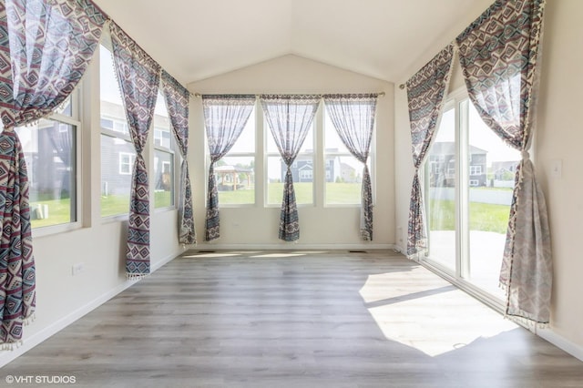 3751 Peregrine Way, Elgin, IL 60124 - unfurnished sunroom featuring plenty of natural light, vaulted ceiling, and wood finished floors