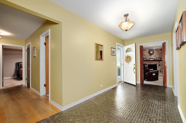 1203 W Francis Dr, Arlington Heights, IL 60005 - foyer entrance featuring baseboards and a brick fireplace