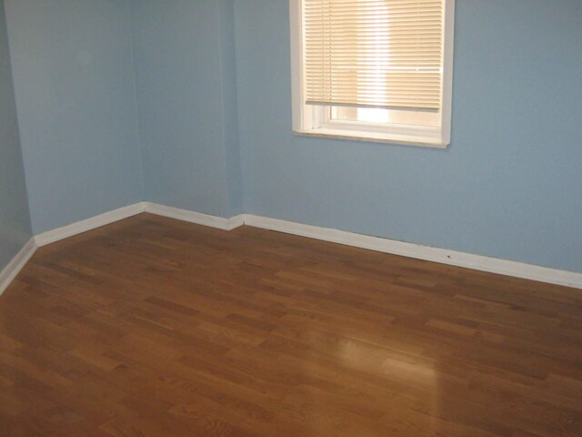 2339 N Kilbourn Ave, Chicago, IL 60639 - unfurnished room featuring wood finished floors and baseboards