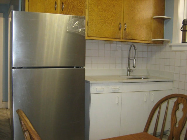 2339 N Kilbourn Ave, Chicago, IL 60639 - kitchen featuring freestanding refrigerator, open shelves, light countertops, and tasteful backsplash