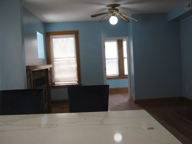 2339 N Kilbourn Ave, Chicago, IL 60639 - living area with a ceiling fan, a fireplace, and wood finished floors