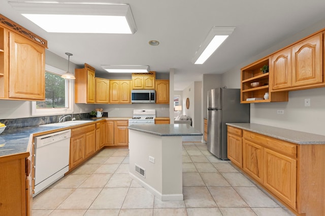 27W268 Hoy Ave, Warrenville, IL 60555 - kitchen featuring stainless steel appliances, open shelves, a sink, and light tile patterned floors