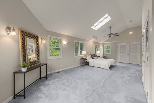27W268 Hoy Ave, Warrenville, IL 60555 - bedroom with vaulted ceiling, baseboards, a skylight, carpet floors, and ceiling fan