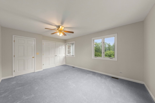27W268 Hoy Ave, Warrenville, IL 60555 - unfurnished bedroom featuring baseboards, carpet flooring, ceiling fan, and a closet