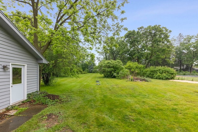 27W268 Hoy Ave, Warrenville, IL 60555 - view of grassy yard featuring view of wooded area