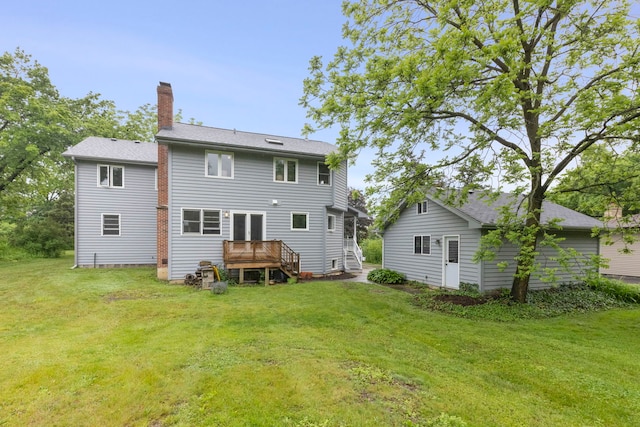 27W268 Hoy Ave, Warrenville, IL 60555 - back of house with a chimney, a lawn, and a wooden deck