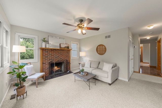 27W268 Hoy Ave, Warrenville, IL 60555 - living room featuring carpet floors, baseboards, a fireplace, and a ceiling fan