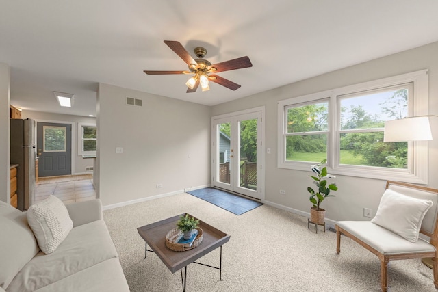 27W268 Hoy Ave, Warrenville, IL 60555 - living room featuring baseboards, light colored carpet, and ceiling fan