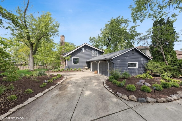 3622 Fairview Ave, Downers Grove, IL 60515 - view of front of house featuring an attached garage, driveway, and a chimney