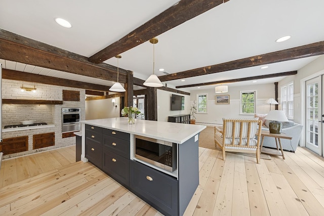 3622 Fairview Ave, Downers Grove, IL 60515 - kitchen with open floor plan, appliances with stainless steel finishes, light wood-style floors, a warming drawer, and beamed ceiling
