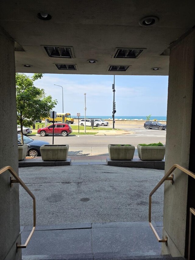 6700 S S Shore Dr Unit 18K, Chicago, IL 60649 - view of road with street lights and a water view