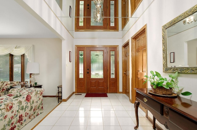 1128 N King Charles Ct, Palatine, IL 60067 - entrance foyer featuring baseboards, a towering ceiling, and light tile patterned floors