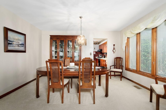 1128 N King Charles Ct, Palatine, IL 60067 - dining room with baseboards and light carpet