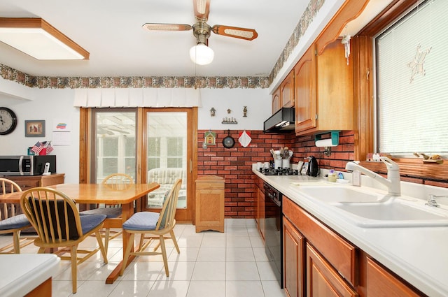 1128 N King Charles Ct, Palatine, IL 60067 - kitchen featuring a sink, black appliances, plenty of natural light, a ceiling fan, and brick wall
