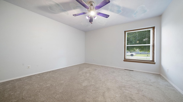 10129 Asbury Ln, Machesney Park, IL 61115 - carpeted empty room with a ceiling fan and baseboards