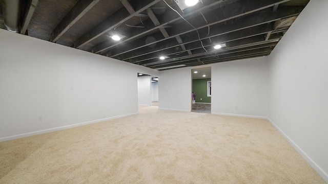 10129 Asbury Ln, Machesney Park, IL 61115 - finished below grade area featuring carpet floors and baseboards