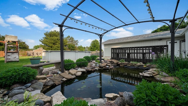 10129 Asbury Ln, Machesney Park, IL 61115 - view of yard featuring a garden pond