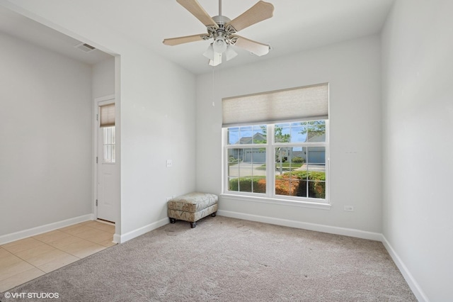 3332 Sheridan Ln, Mundelein, IL 60060 - empty room featuring carpet flooring, ceiling fan, and tile patterned flooring