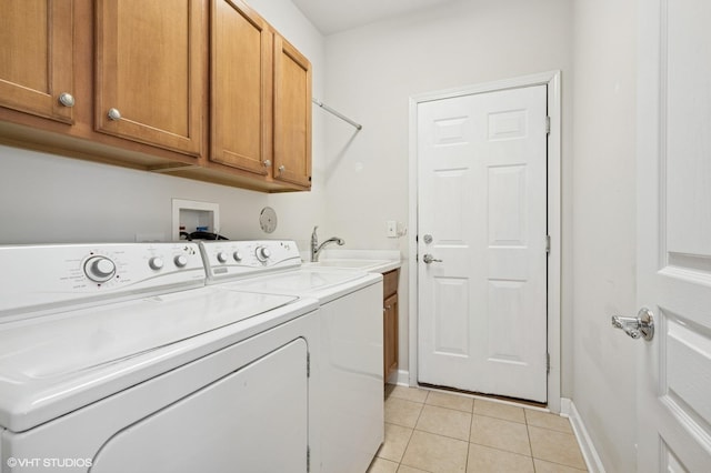 3332 Sheridan Ln, Mundelein, IL 60060 - laundry area featuring independent washer and dryer, cabinet space, and light tile patterned floors