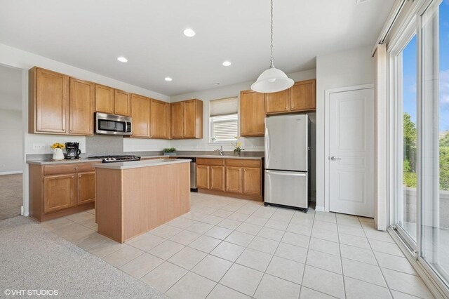 3332 Sheridan Ln, Mundelein, IL 60060 - kitchen featuring stainless steel appliances, recessed lighting, light tile patterned flooring, light countertops, and a kitchen island