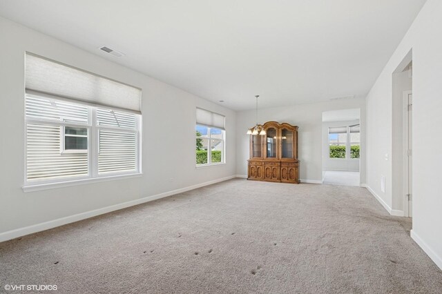 3332 Sheridan Ln, Mundelein, IL 60060 - unfurnished living room with carpet and a chandelier