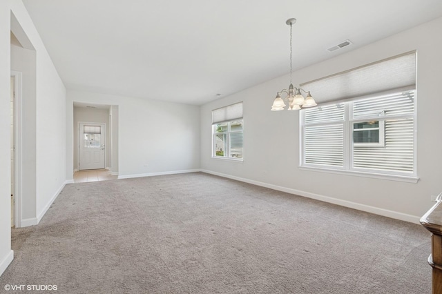 3332 Sheridan Ln, Mundelein, IL 60060 - empty room featuring a chandelier and carpet flooring