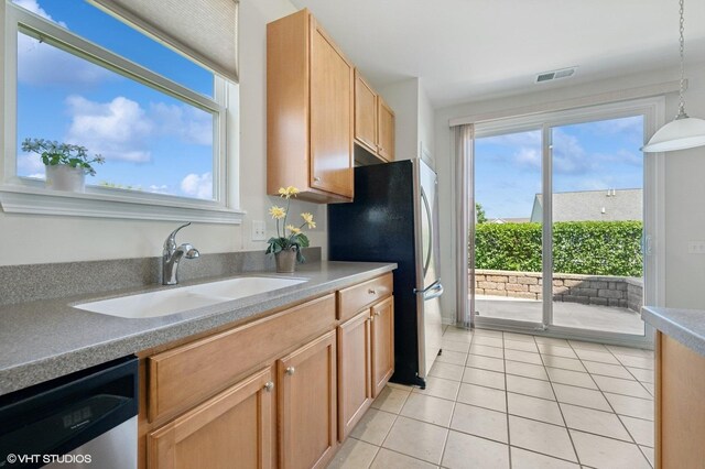 3332 Sheridan Ln, Mundelein, IL 60060 - kitchen with appliances with stainless steel finishes, light tile patterned floors, and hanging light fixtures