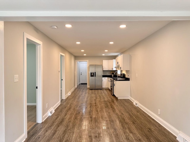 1327 N Pleasant Dr, Round Lake Beach, IL 60073 - kitchen with stainless steel appliances, dark wood finished floors, recessed lighting, white cabinets, and baseboards