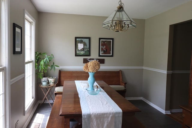 1900 Waverly Ln, Algonquin, IL 60102 - dining area featuring a chandelier, wood finished floors, and baseboards