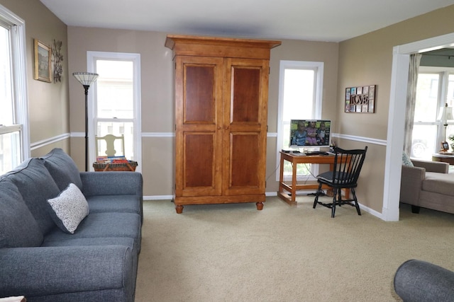 1900 Waverly Ln, Algonquin, IL 60102 - living room featuring light colored carpet, a desk, and baseboards