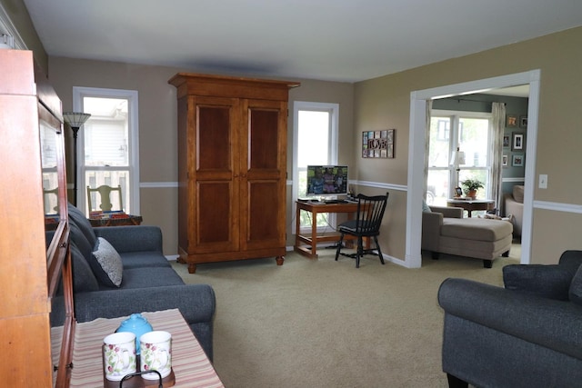 1900 Waverly Ln, Algonquin, IL 60102 - carpeted living area featuring healthy amount of natural light, baseboards, and a desk