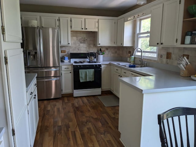 1900 Waverly Ln, Algonquin, IL 60102 - kitchen featuring range with gas stovetop, stainless steel fridge with ice dispenser, a sink, a peninsula, and dark wood-style flooring
