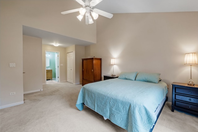 3502 Lake Side Cir, Joliet, IL 60431 - bedroom featuring light carpet, baseboards, connected bathroom, high vaulted ceiling, and a closet