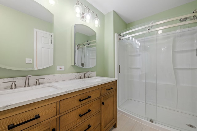 3502 Lake Side Cir, Joliet, IL 60431 - full bathroom featuring a shower stall, double vanity, and wood finished floors