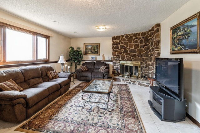 1243 W Byron Ave, Addison, IL 60101 - living room featuring a textured ceiling, light tile patterned flooring, and a stone fireplace